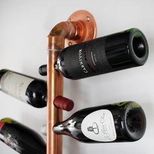 Copper Hanging Wine Rack. Modern Wall Mounted Copper Pipe Wine Bottle Holder for 10  Vino Bottles on an Angle. Elegant Wine Cellar Storage