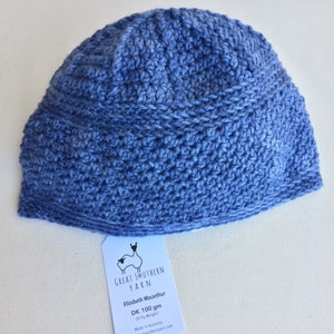 May include: A blue crocheted beanie hat made with Great Southern Yarn Elizabeth Macarthur DK 100 gm yarn. The yarn is 8 ply weight and made in Australia.