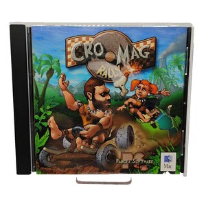 May include: A Cro-Mag Rally video game jewel case featuring a cartoon illustration of two cave-dwelling characters racing in primitive vehicles. The title text Cro-Mag Rally is displayed at the top, with Pangea Software and Mac logos visible.