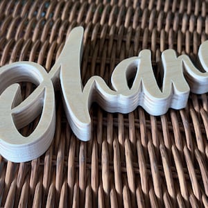 May include: A set of three ceramic mugs with a speckled, matte finish. The mugs are in shades of cream, light gray, and dark gray. Each mug has a simple, minimalist design, perfect for coffee or tea.