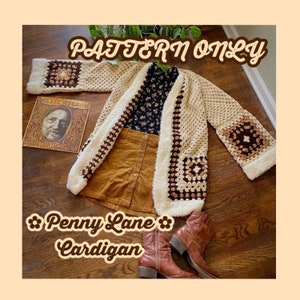 May include: A crochet cardigan with a brown and white granny square pattern. The cardigan has a fluffy white trim and is open in the front. The text "Penny Lane Cardigan" is written below the cardigan.
