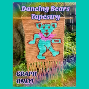 May include: A rectangular crochet wall hanging featuring a light brown background with a central turquoise bear graphic, a pink collar, and brown accents. The piece hangs from a wooden dowel and includes a fringe at the bottom. Text reads Dancing Bears Tapestry and GRAPH ONLY.