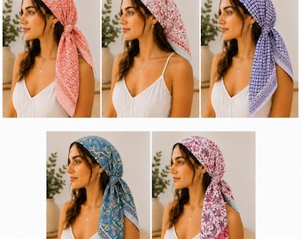 May include: A collection of five square head scarves featuring various floral and geometric patterns in orange, red, blue, teal, and pink. Each scarf is tied around the head in a triangular style, showcasing intricate borders and detailed prints.