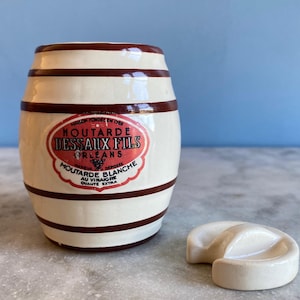 An antique French porcelain mustard pot, Dessaux & Fils