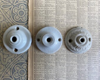 A vintage French porcelain ceiling rose