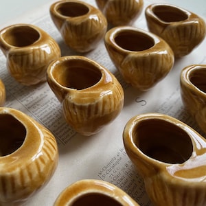 A dozen vintage French ceramic snail dishes, snail pots