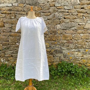 A vintage French linen smock or chemise, initials SF, decorative embroidery
