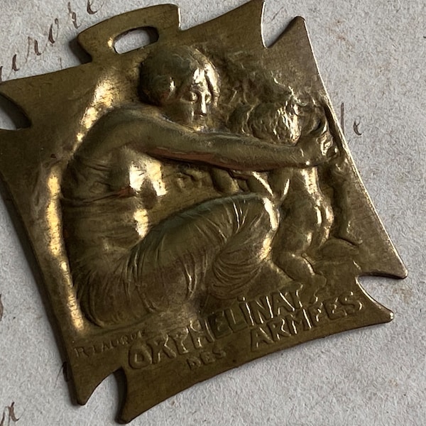 An antique French brass medal, Orphelinat des Armees, Rene Lalique, 1915