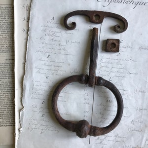 A vintage French iron door knocker, door handle, iron door knocker