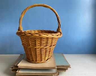 A vintage French handmade willow basket, small shopping basket