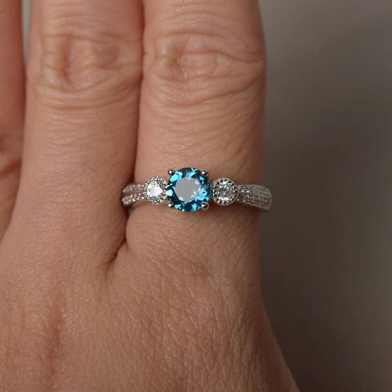 Real blue topaz best sale rings