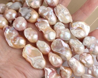 May include: A strand of baroque pearls in shades of pink, white, and cream. The pearls are irregular in shape and have a high luster.