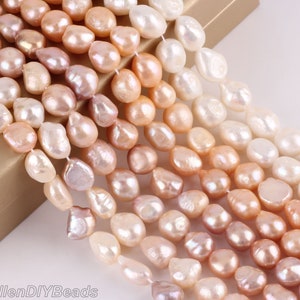 May include: A strand of baroque freshwater pearls in various shades of pink, white, and cream. The pearls are irregular in shape and have a natural luster.