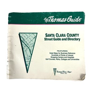 May include: A green and white cover for a Santa Clara County street guide and directory. The cover features a map of the area and the text "The Thomas Guide" and "Santa Clara County Street Guide and Directory".