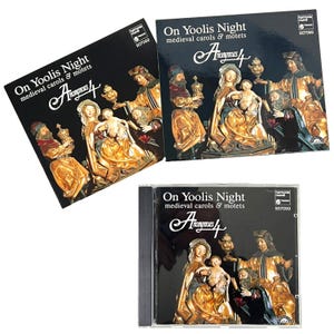 May include: Three CDs of "On Yoolis Night" medieval carols and motets by Anonymous 4. The album covers are black with gold-colored religious figures. The text "On Yoolis Night" and "Anonymous 4" are in white script.