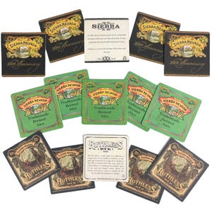 May include: A collection of Sierra Nevada beer coasters. Some are black with gold lettering and say "30th Anniversary." Others are green with "Traditionally Brewed Ales." There are also coasters for "Ruthless Rye" beer.