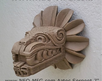 May include: A 7-inch Aztec Serpent sculpture made of aged stone. The sculpture is brown and has intricate details, including a feathered headdress and a serpent's head with an open mouth.