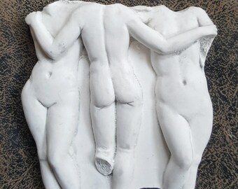 May include: White marble sculpture of three Graces, each with their arms around the other, standing side by side. The sculpture is 3 inches tall and is titled "3 Graces 3" on the base.