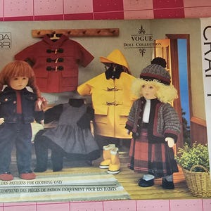 May include: Vogue Craft doll clothing pattern. The pattern features doll clothing designs, including a red coat, yellow raincoat, and a plaid skirt outfit. The package includes patterns for clothing only. The Vogue Doll Collection is designed by Linda Carr.
