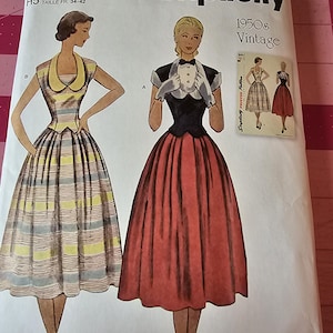May include: A vintage Simplicity sewing pattern from the 1950s. The pattern features illustrations of two dresses, one with a striped skirt and the other with a red skirt. The pattern size is U.S. 6-14.