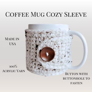 May include: White crocheted coffee mug cozy with a brown button and buttonhole closure. Made in the USA with 100% acrylic yarn.