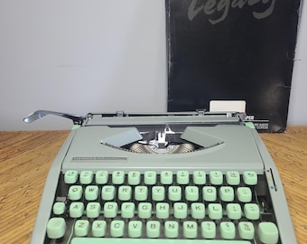 Vintage Hermes Baby Rocket Typewriter with Original Case and Booklet