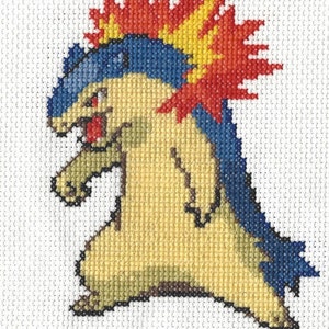 Könnte beinhalten: Kreuzstichmuster eines gelben und blauen Pokémon mit einem rot-gelben flammenartigen Kamm auf dem Kopf.