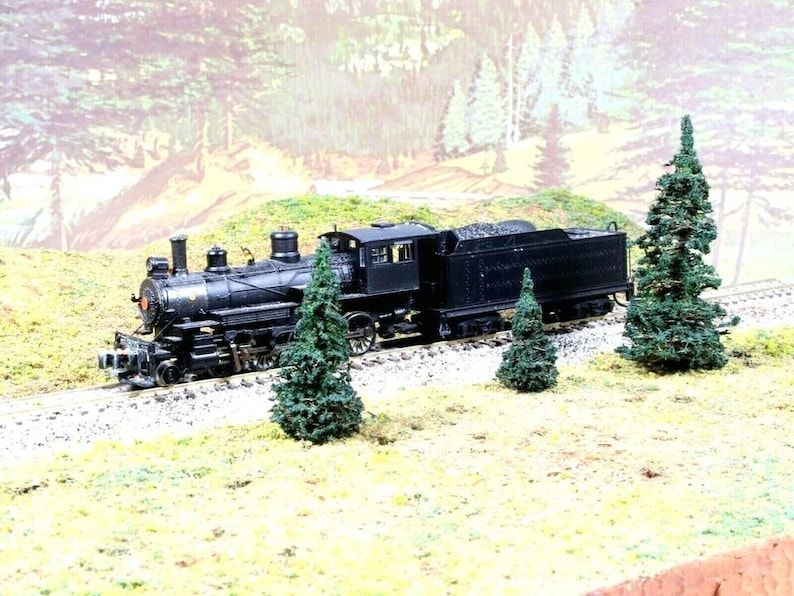 12 pcs of N Scale PINES by ELK RIVER. 1" 1.5" & 2" Hand-Made & Hand-Painted a Dark Alpine Green.