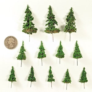 May include: A set of twelve miniature green pine trees, perfect for model railroading or miniature landscaping projects.