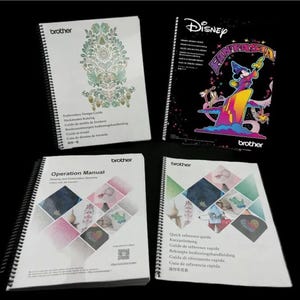 May include: Four spiral bound books with the Brother logo on the cover. The books are titled "Embroidery Design Guide", "Operation Manual", "Quick Reference Guide", and "Disney Fantasia".