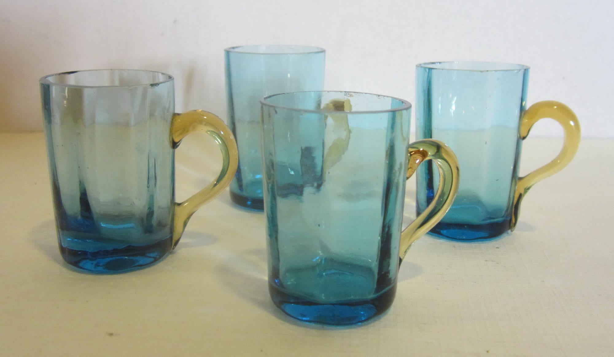 4 Antique shot glasses, blue glass amber handle, manganese UVreactive  glow glass, Victorian; 2 inch high, ca 1880 - 1900