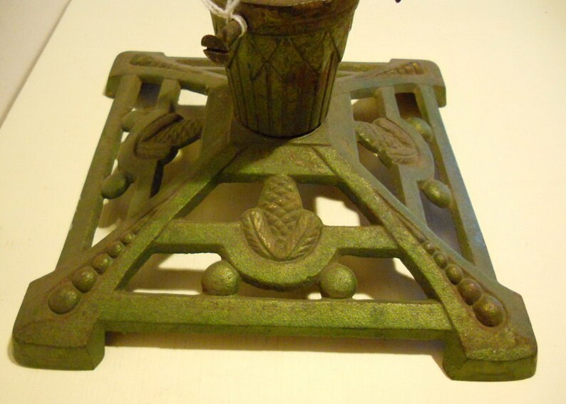 fir cone decoration; ca 1920 base; art deco Antique cast iron christmas tree stand holder