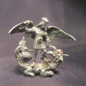 Antique silver St Michel or saint George, slaying the dragon, brooch, with rubis