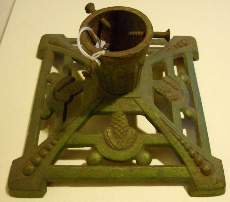 fir cone decoration; ca 1920 base; art deco Antique cast iron christmas tree stand holder