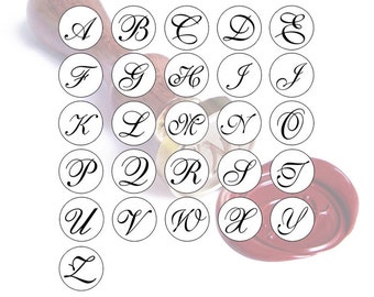 May include: A set of 26 round wax seal stamps featuring the alphabet in a cursive font. Each stamp is white with a black letter inside.