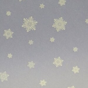 May include: A light purple background with a repeating pattern of white snowflakes.