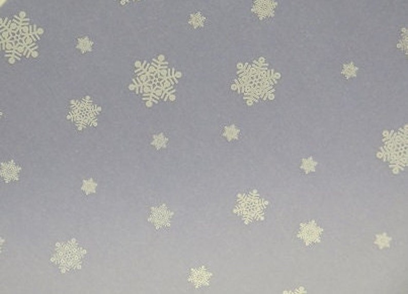 May include: A light purple background with a repeating pattern of white snowflakes.