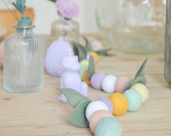 Colorful Easter garland made of wool for decorating the table, doors and windows