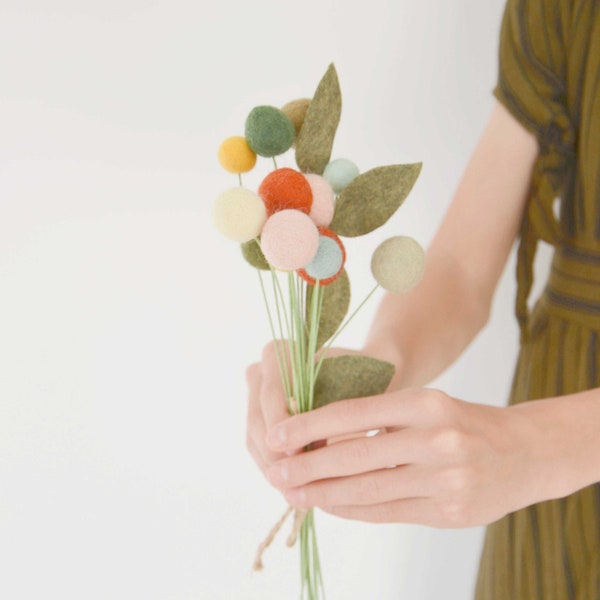 Small bouquet of flowers in felted wool balls and merino wool leaves