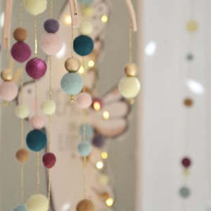 Colorful decorative poetic mobile pastel and eggplant with golden thread and golden balls for home decoration