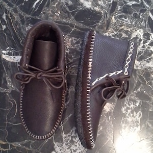 Buffalo Hide moccasins lined with deerskin, with a double buffalo insole. Soft sole, no rubber bottom. Custom order