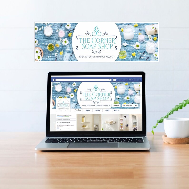 May include: A laptop computer displaying a Facebook page for "The Corner Soap Shop" with a blue and white floral design. The page features a timeline, about, friends, photos, and more tabs. The page header features a blue and white floral design with the text "The Corner Soap Shop" and "Handcrafted Bath and Body Products".