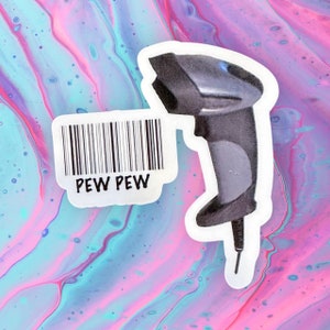 May include: A white sticker with a barcode and the text "PEW PEW" is placed on a pink and blue marbled background. A black and gray barcode scanner is also on the sticker.