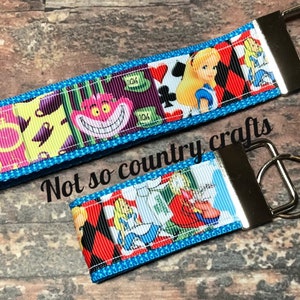 Disneys alice in wonderland key fob, key chain, wristlet, clutch