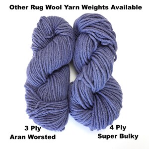 May include: Two skeins of blue wool yarn, one labeled "3 Ply Aran Worsted" and the other labeled "4 Ply Super Bulky".