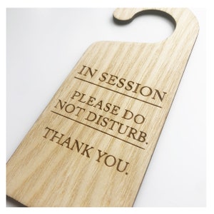 May include: Wooden door hanger with the text "IN SESSION PLEASE DO NOT DISTURB. THANK YOU."
