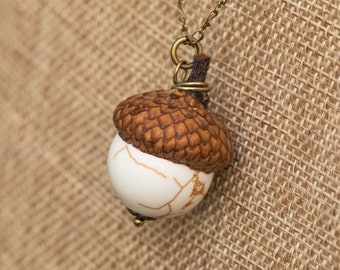 White and tan howlite stone acorn necklace with real acorn cap on long bronze chain