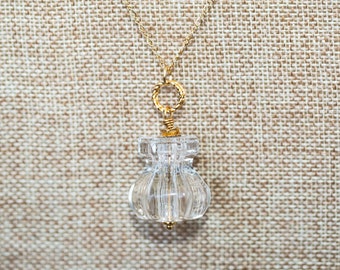 Antique clear glass knob long necklace with gold twisted rings and metal flower bead cap accent