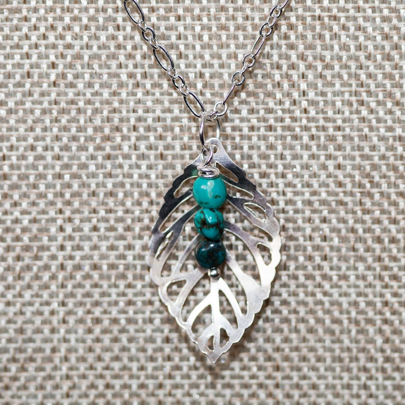 Silver leaf necklace with a turquoise dangle