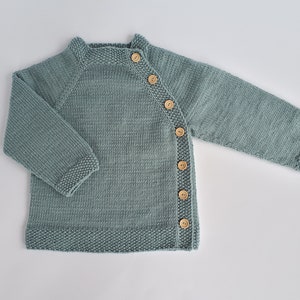 MADE TO ORDER/ Hand knitted side fastened baby sweater/ Merino wool Light greyish green